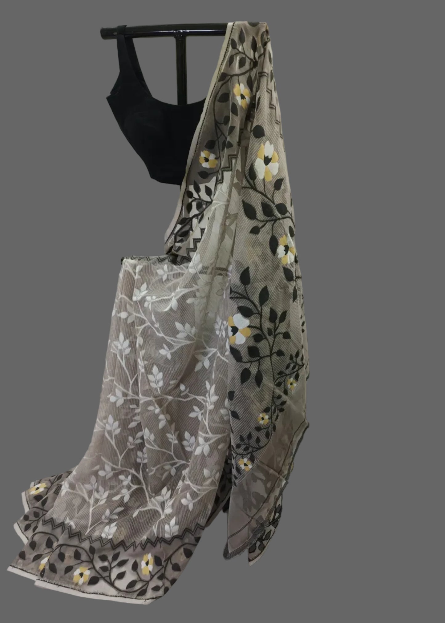 Embroidered saree with floral patterns on a white background