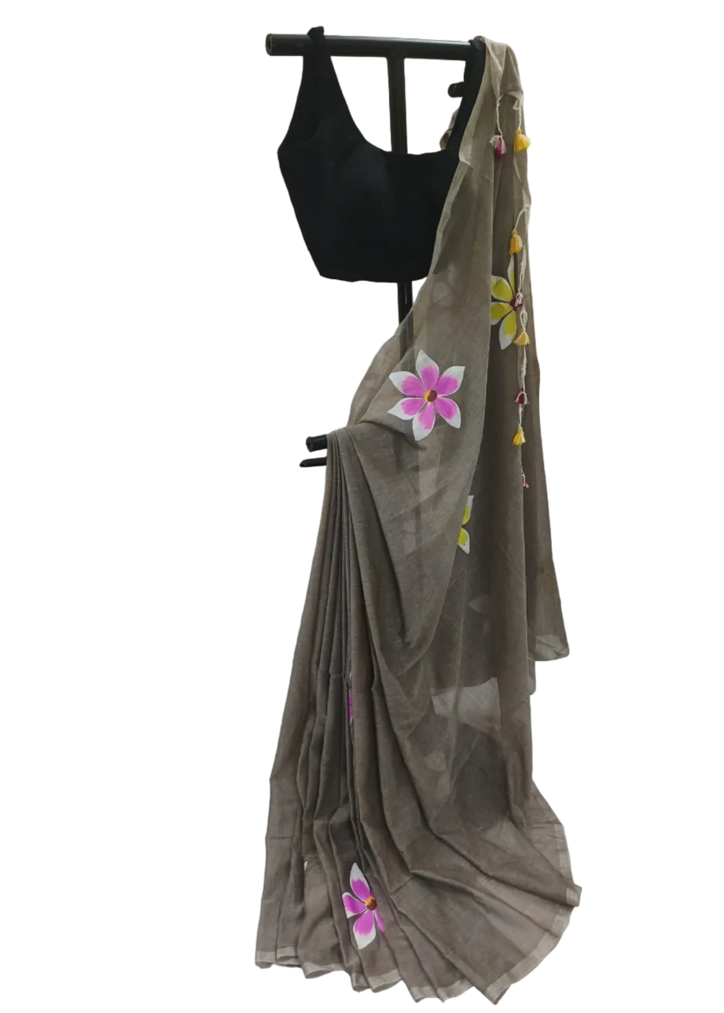 Brown saree with floral embroidery on a black mannequin against a plain background