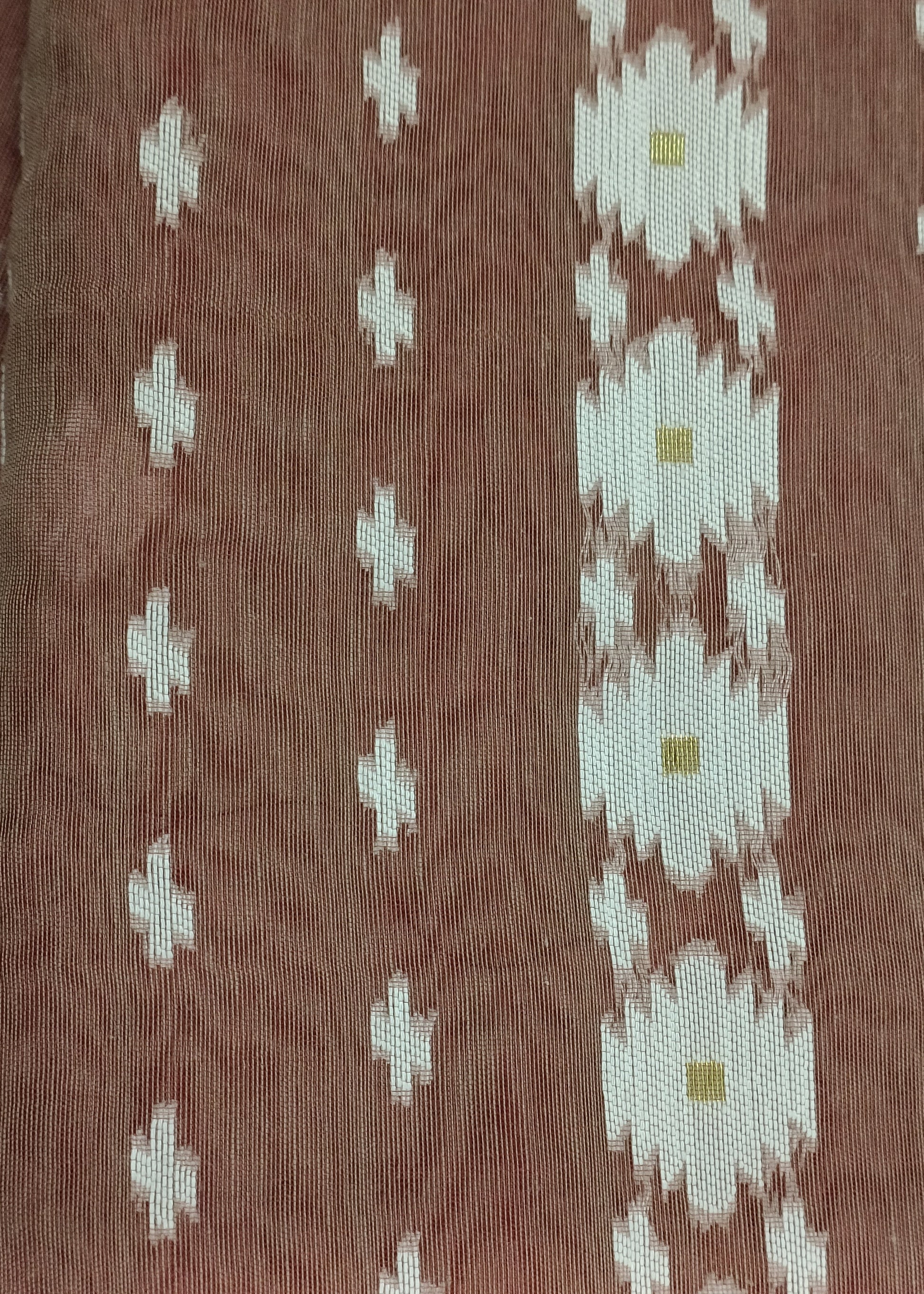 Brown fabric with white geometric patterns