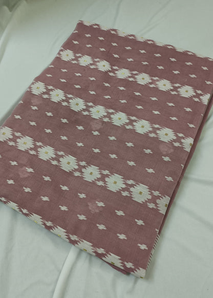 Pink fabric with white floral pattern on a white background