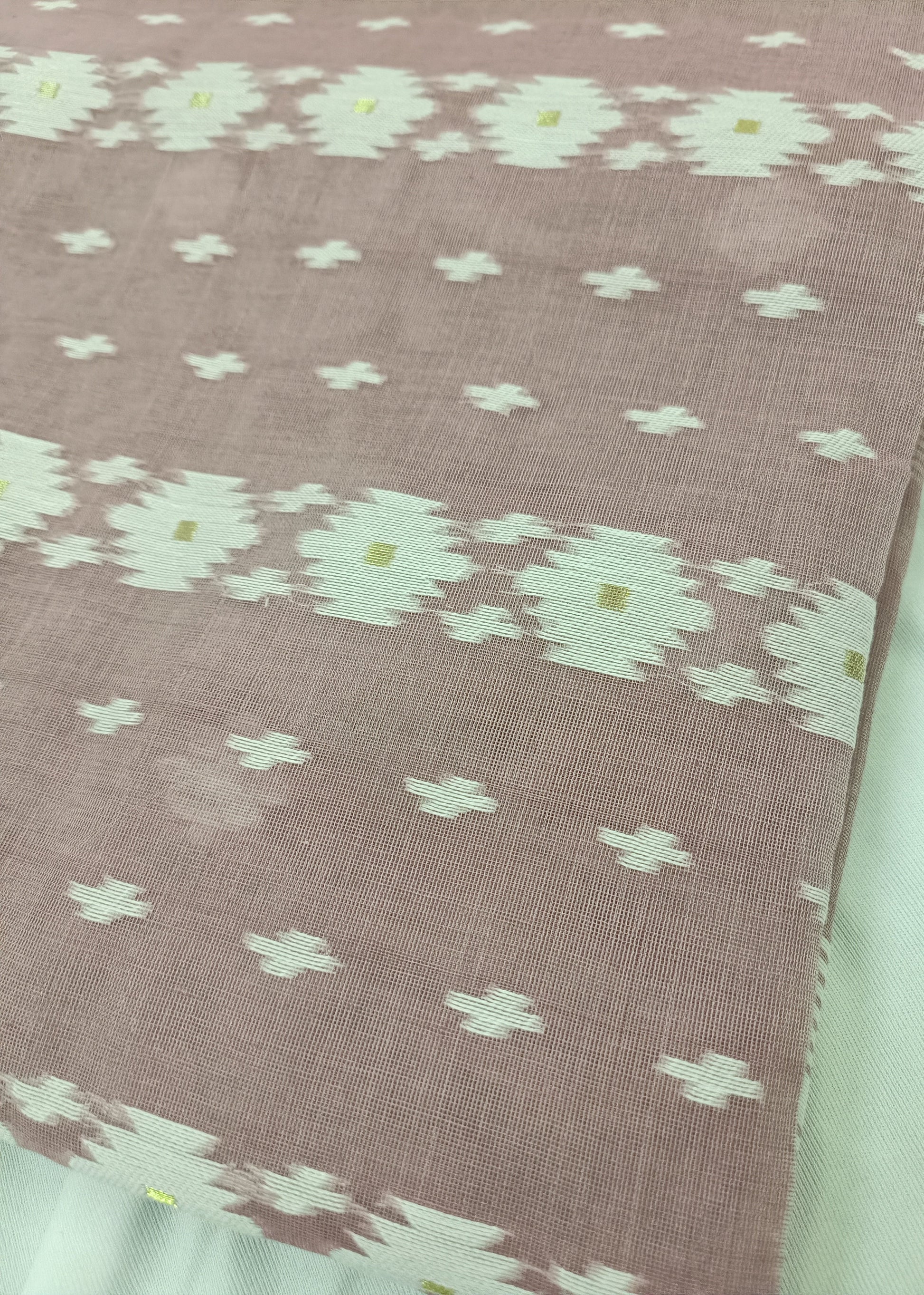 Fabric with a floral pattern on a pink background