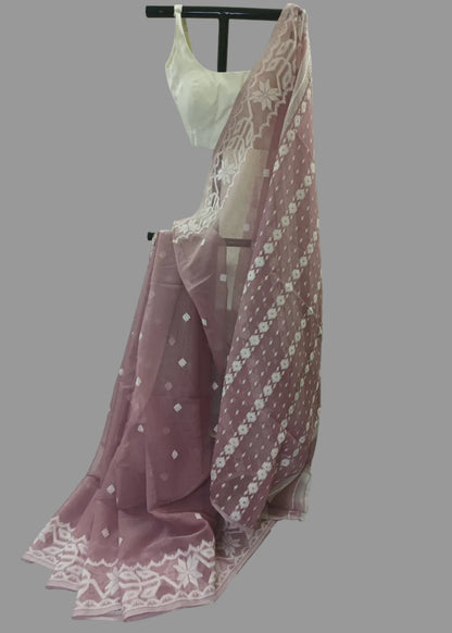 Pink lace garment on a mannequin against a white draped background