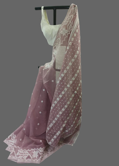 Pink floral dress with a white lace overlay on a white background