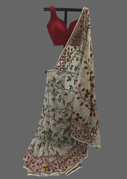 Red blouse with beige floral saree on a white background