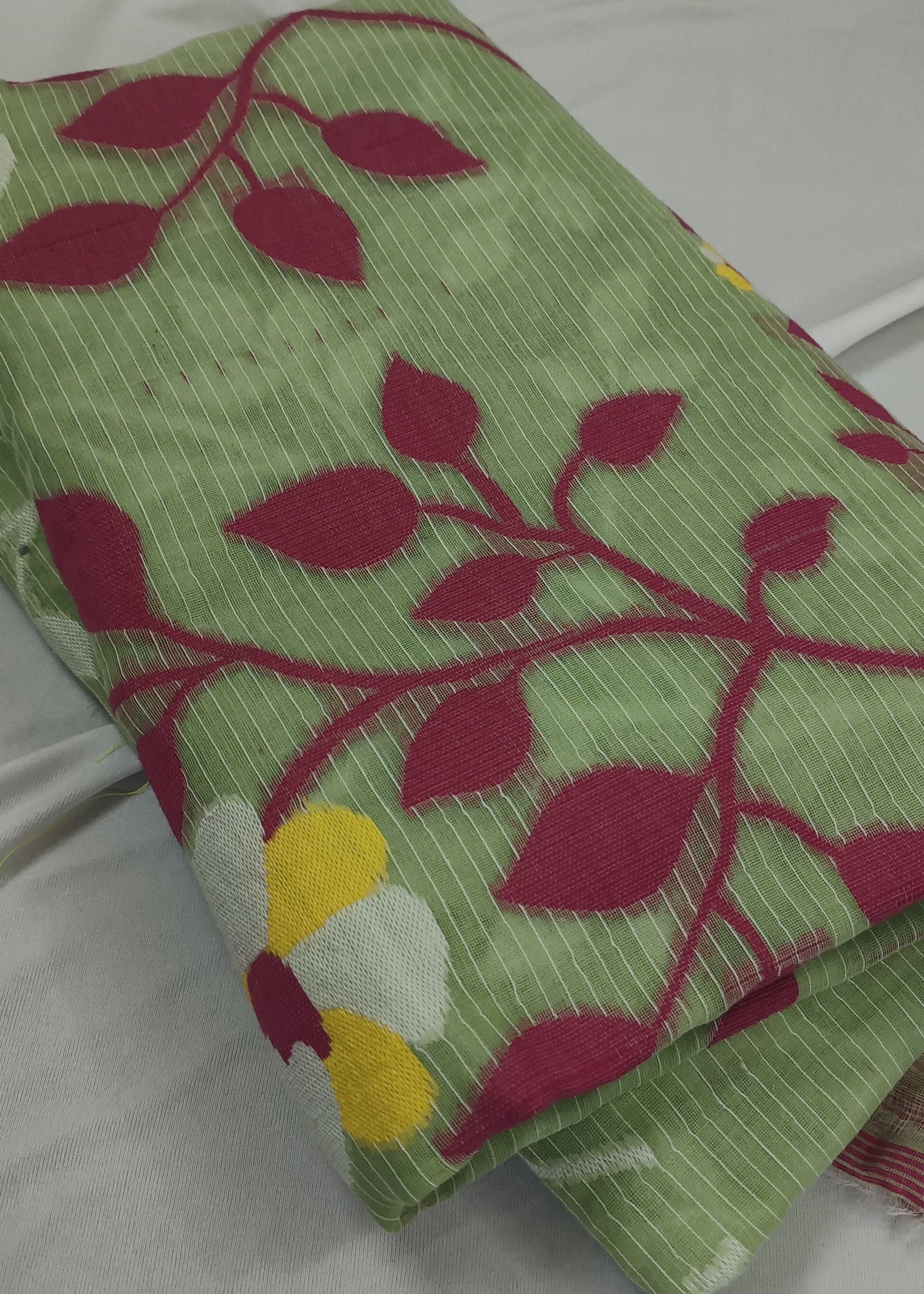 Folded fabric with leaf pattern on a white background