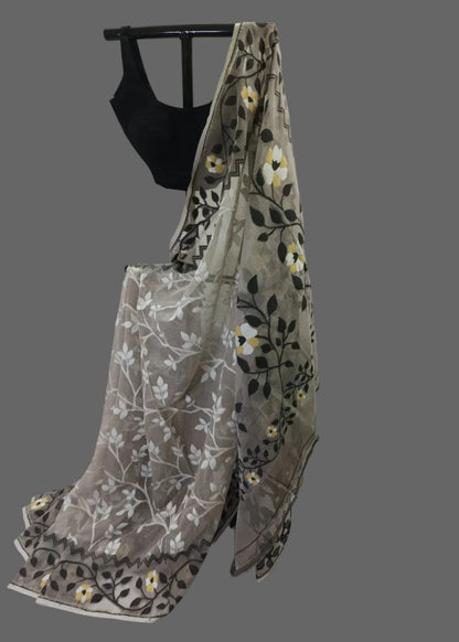 Embroidered saree with floral patterns on a white background