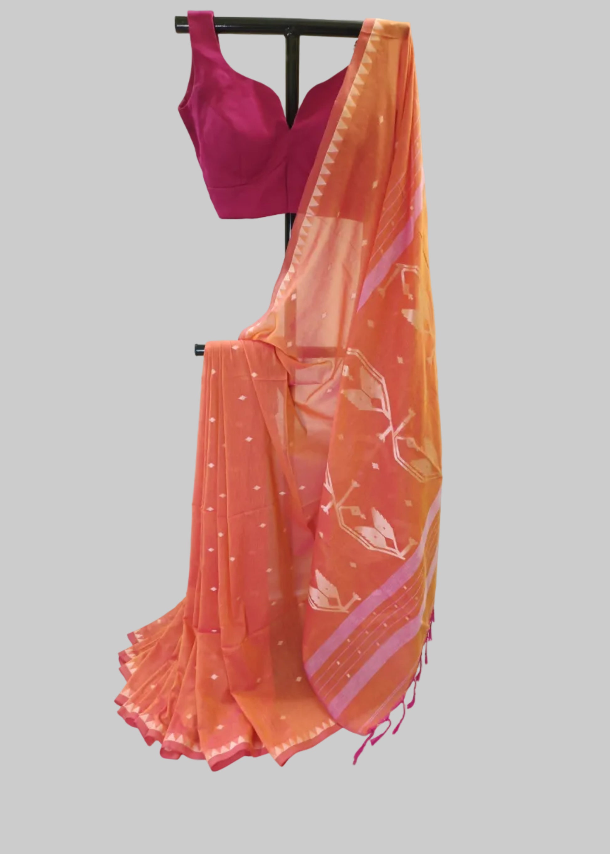 Orange saree with pink blouse on a white background