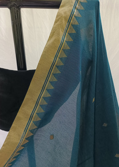 Teal fabric with gold border draped over a chair against a white background