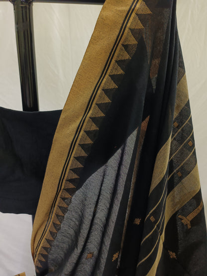 Textile with geometric pattern draped over a chair against a white background