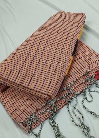 Textile with checkered pattern and tassels on a white background