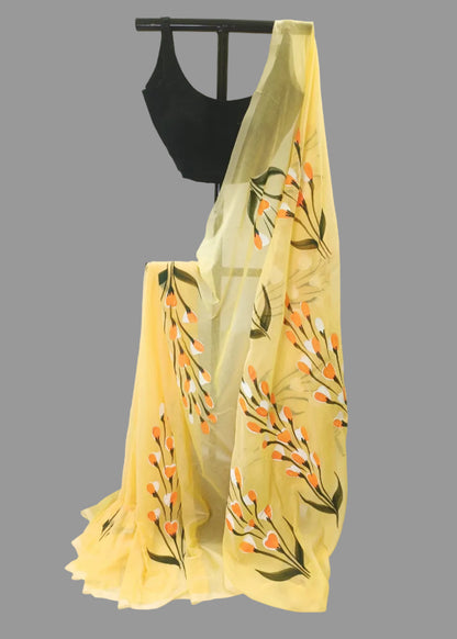 Yellow floral saree with a black blouse on a white background