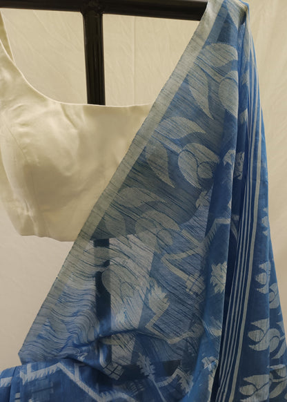 Blue floral patterned fabric draped over a mannequin with a white background