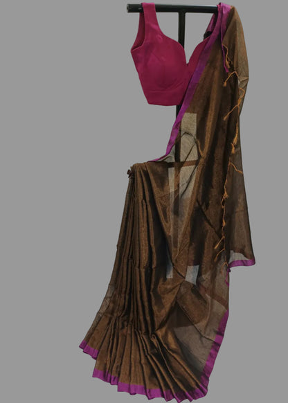 Brown saree with pink border draped over a mannequin against a white background