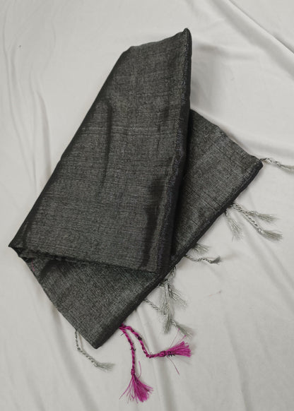 Dark gray fabric with tassels on a light background