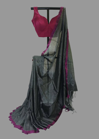 Gray saree with purple border draped over a stand against a white background