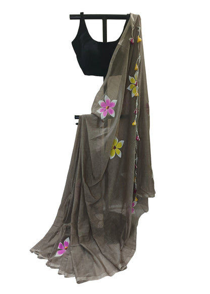 Brown saree with floral patterns on a white background