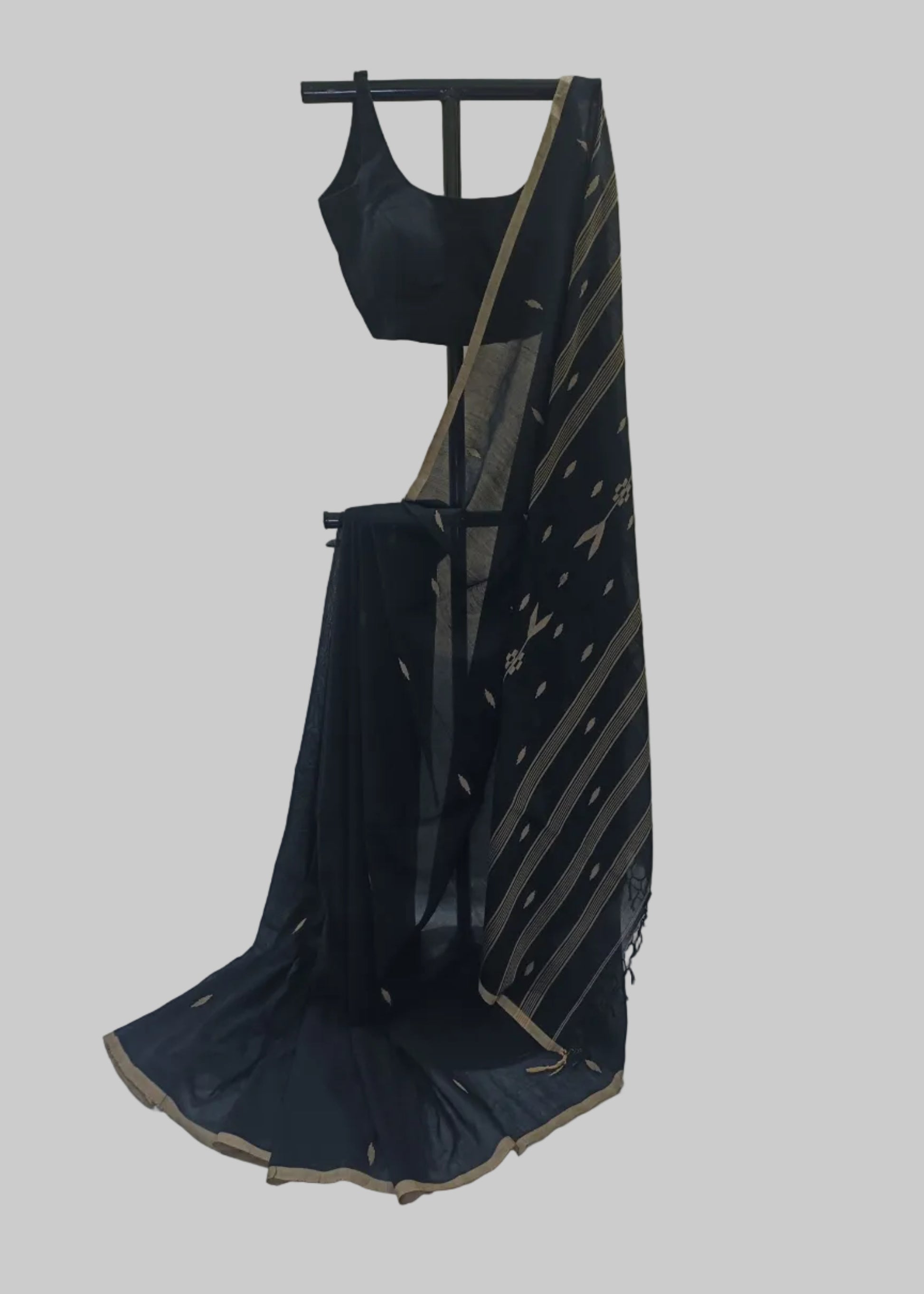 Navy blue saree with gold border on a mannequin against a neutral background