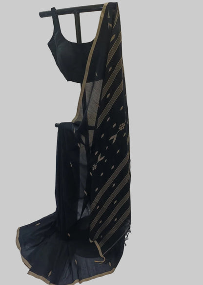 Black and gold saree with a matching blouse on a mannequin against a plain background