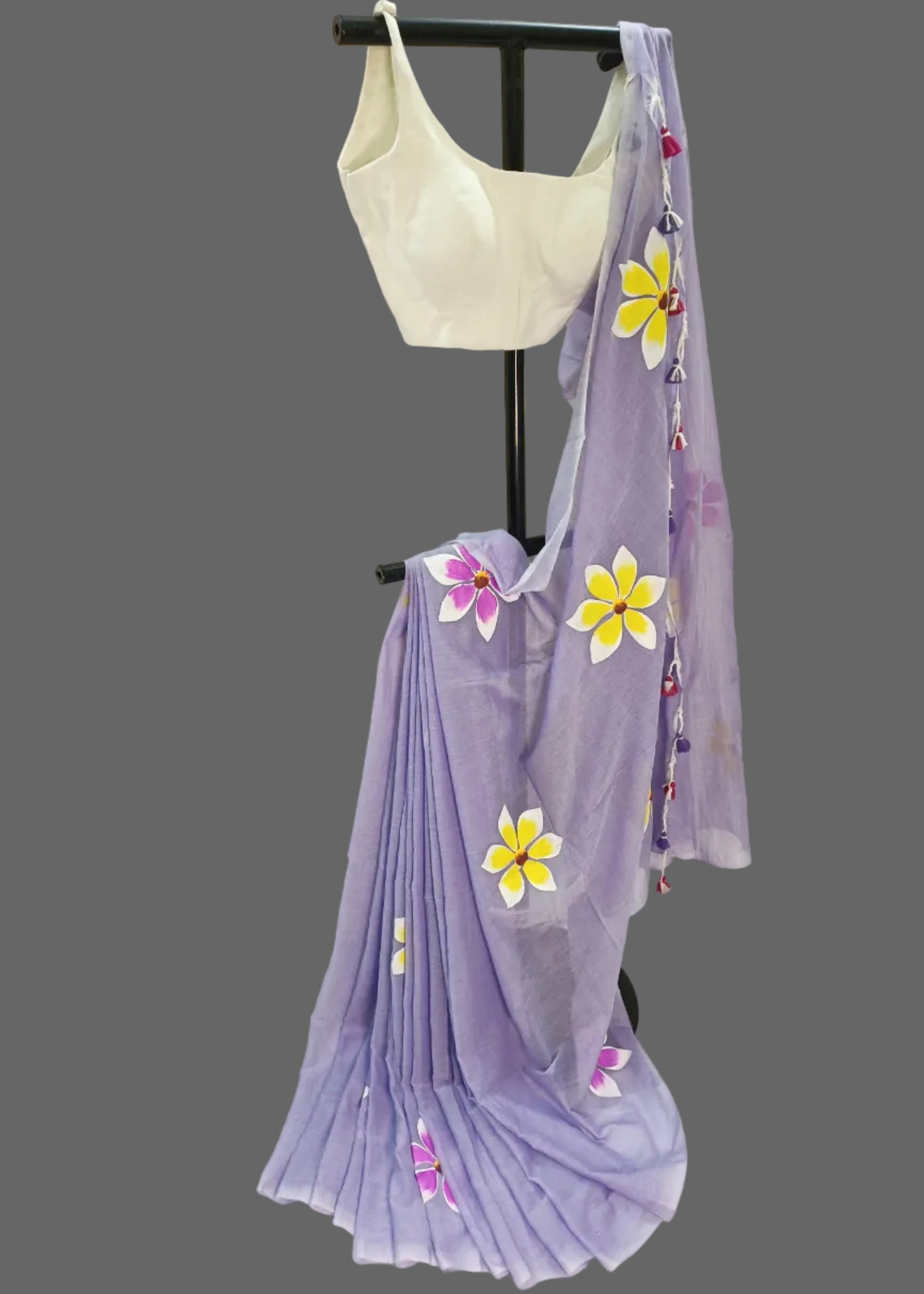 Light purple saree with floral patterns on a white background
