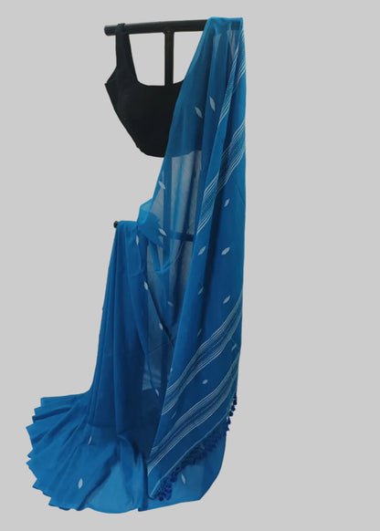 Blue saree draped over a black mannequin against a plain background