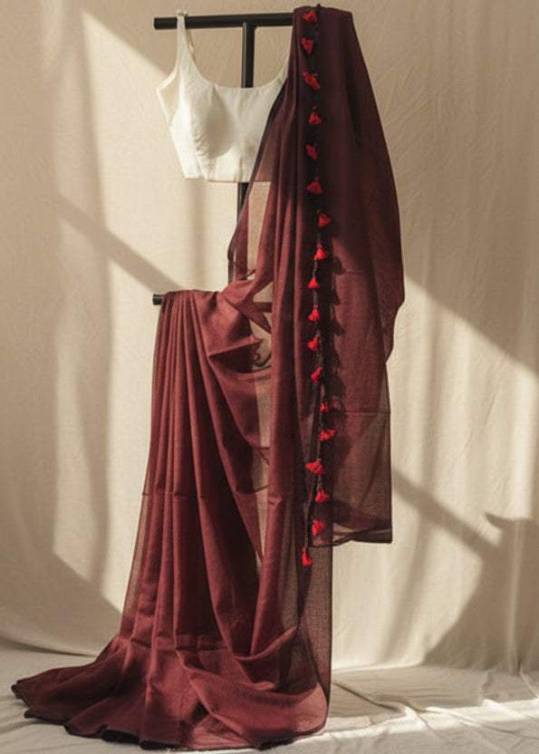 Maroon mul cotton saree with red heart patterns on a white background 