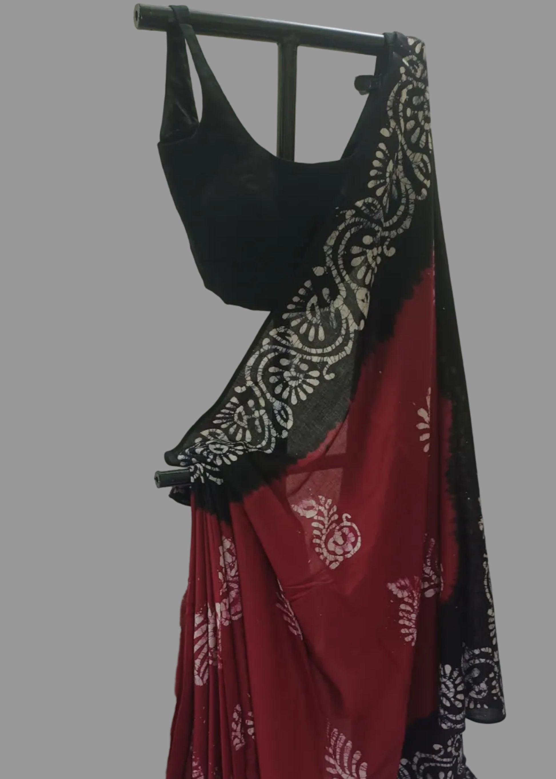 Black and red outfit with white patterns on a white background