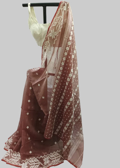Red and white embroidered dupatta draped over a mannequin against a white curtain background