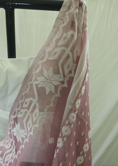 Pink fabric with white floral pattern draped over a black rod against a white background