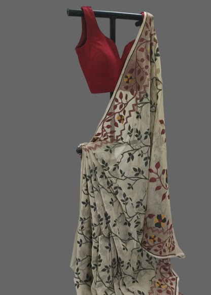 Beige floral saree with a red blouse on a white background