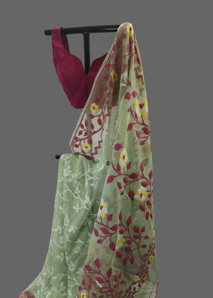 Green floral saree with a pink blouse on a white background