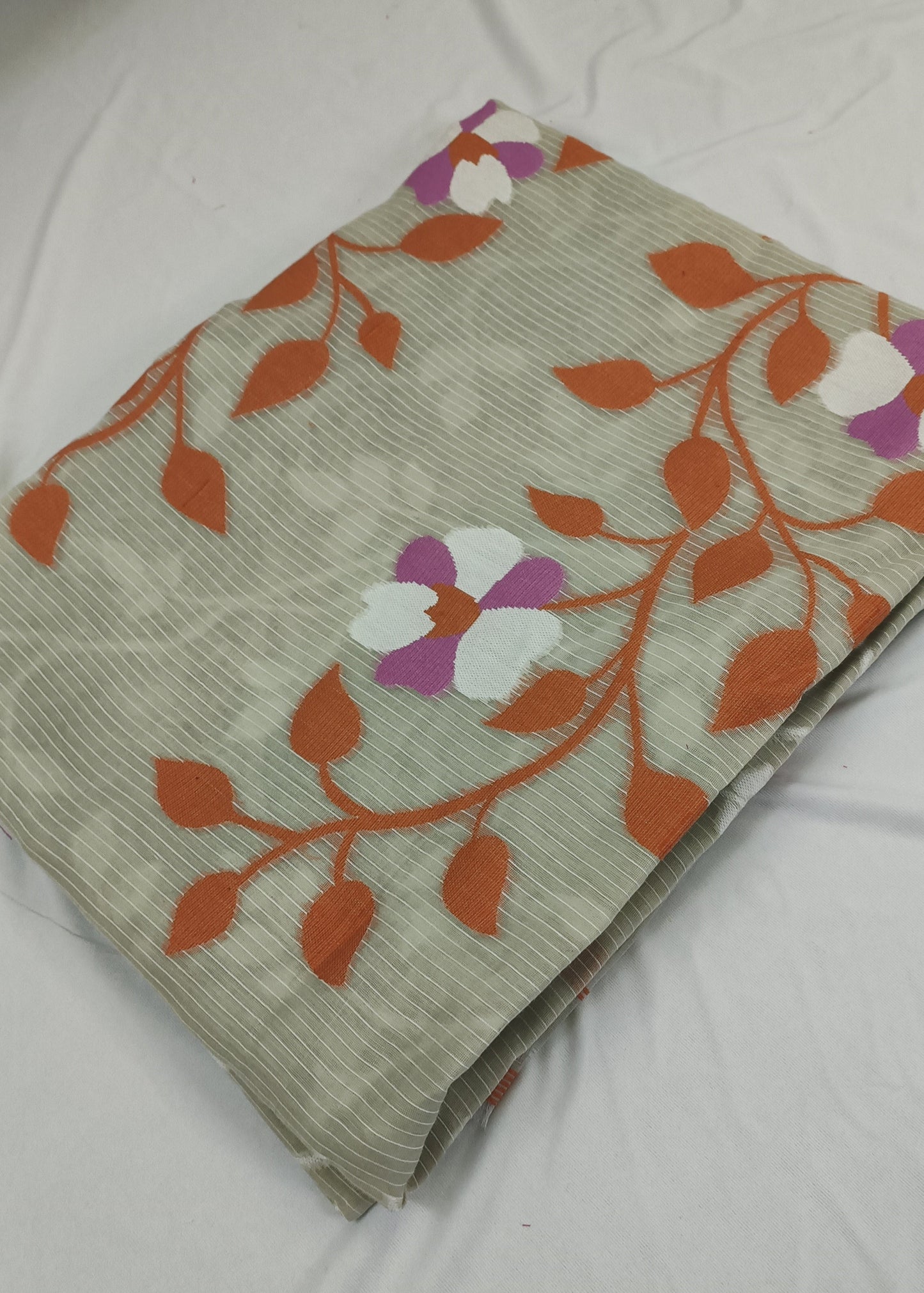 Folded fabric with floral pattern on a white background