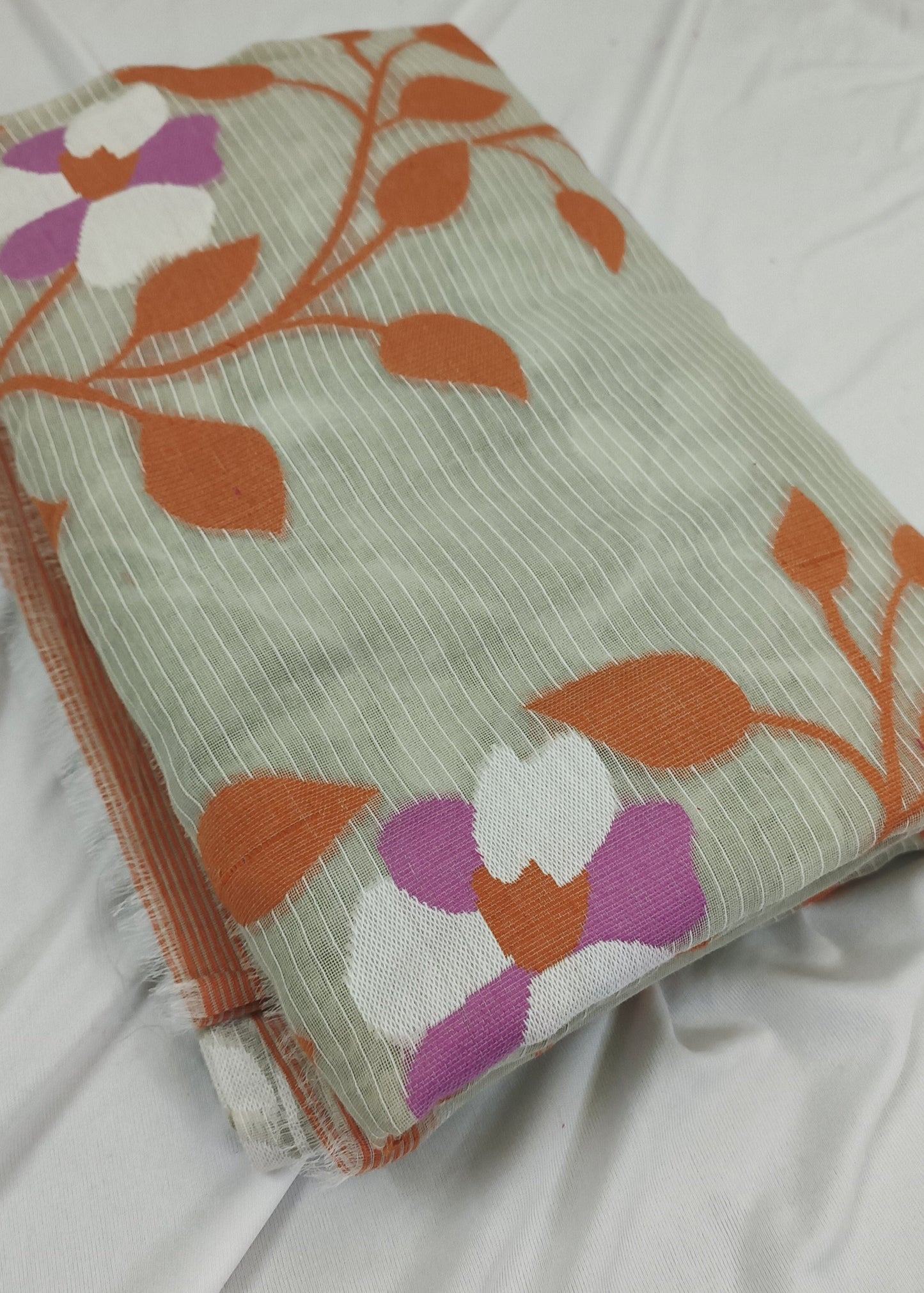 Folded fabric with floral pattern on a white background