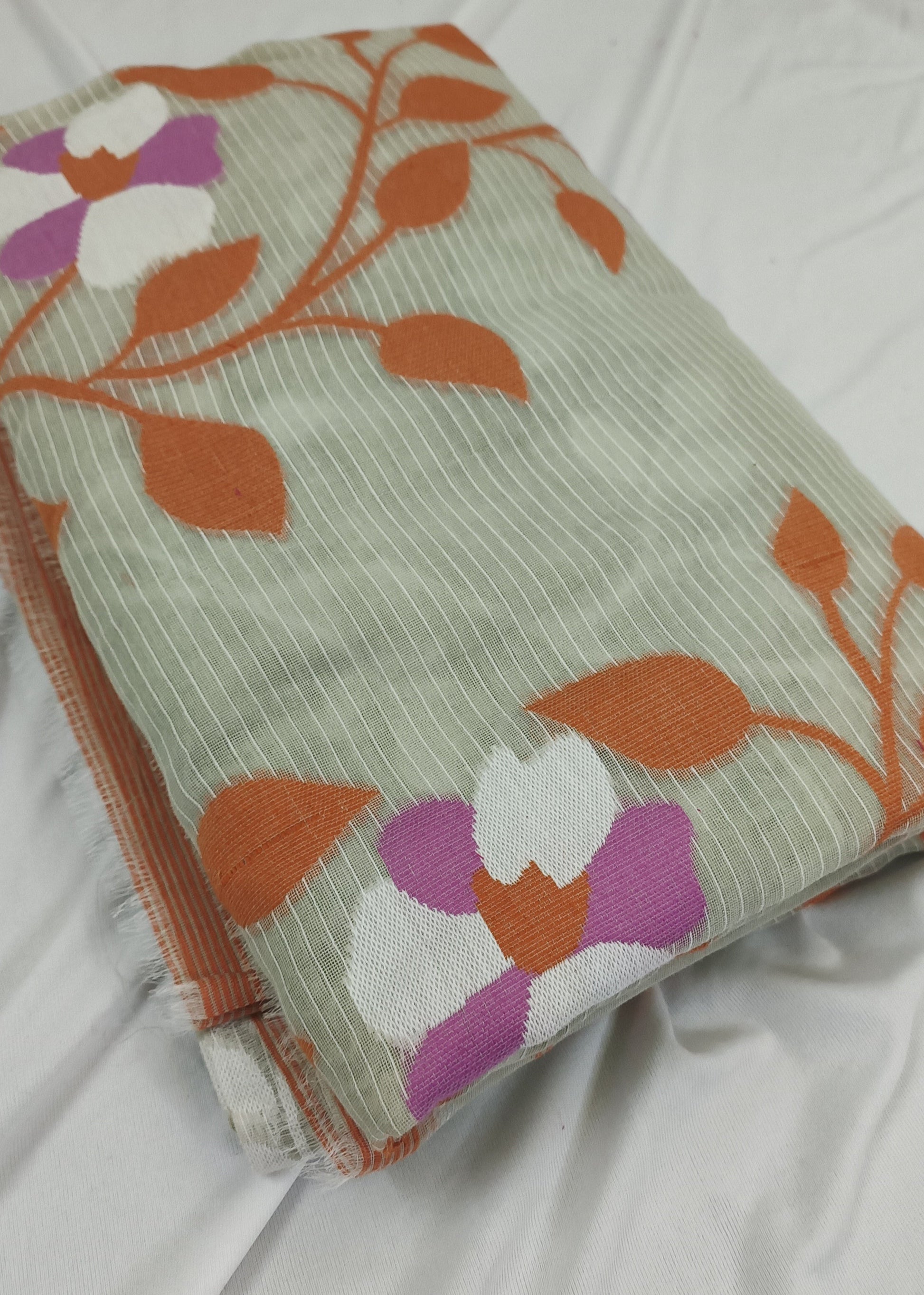 Folded fabric with floral pattern on a white background