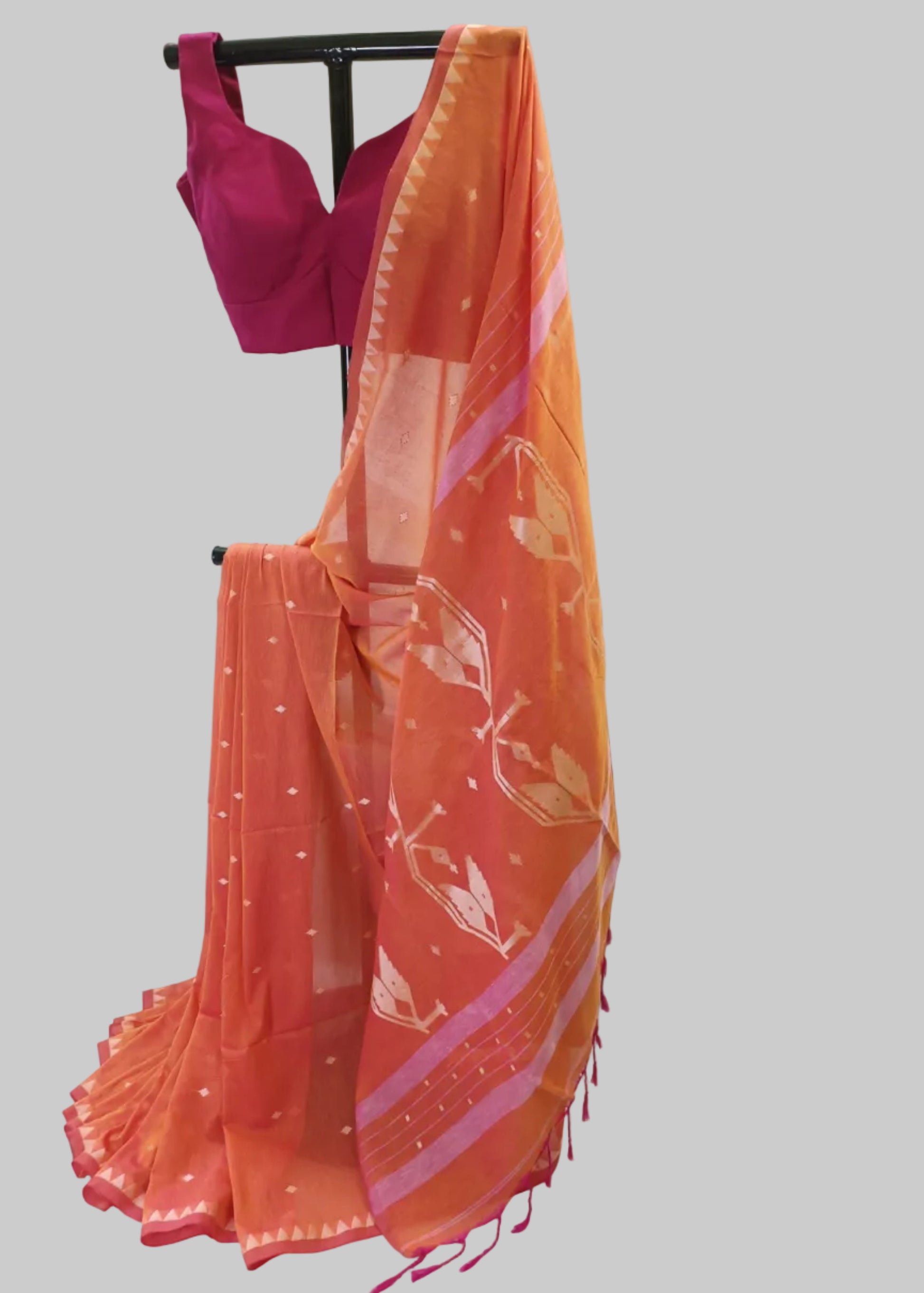 Orange saree with pink blouse on a white background