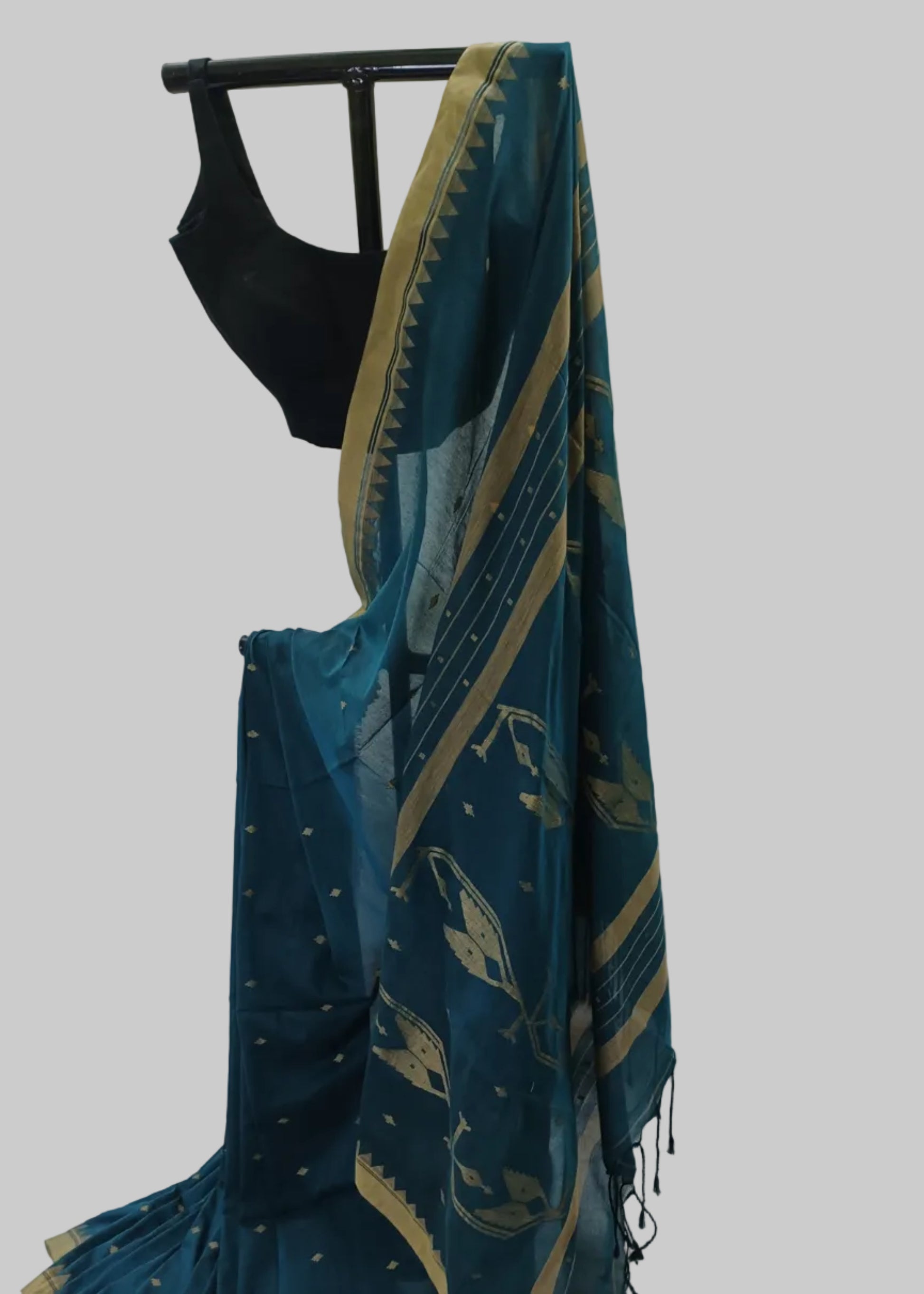 Teal saree with gold patterns on a white background