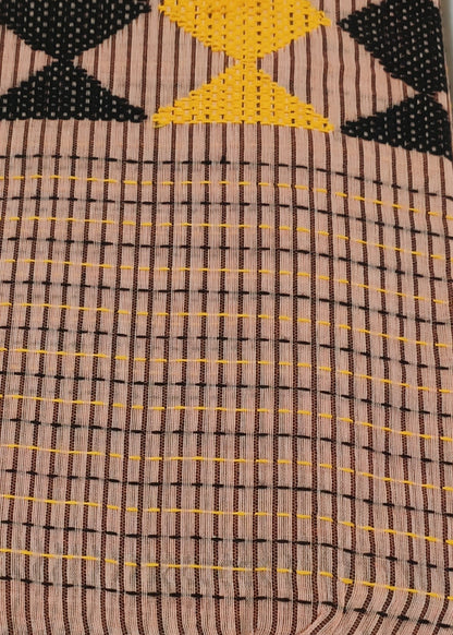 Close-up of fabric with geometric pattern on a light blue background