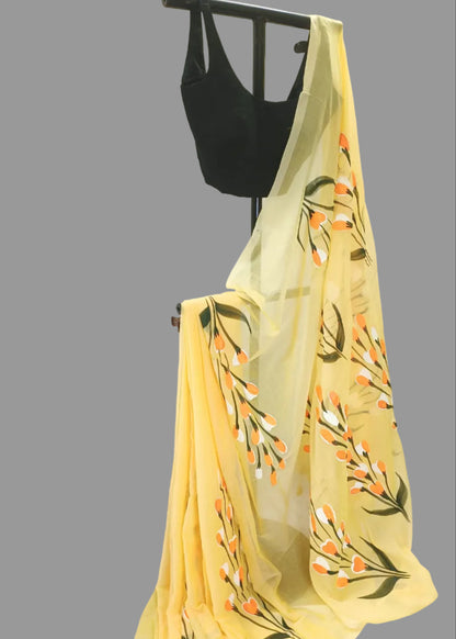 Yellow floral scarf draped over a black top against a white background