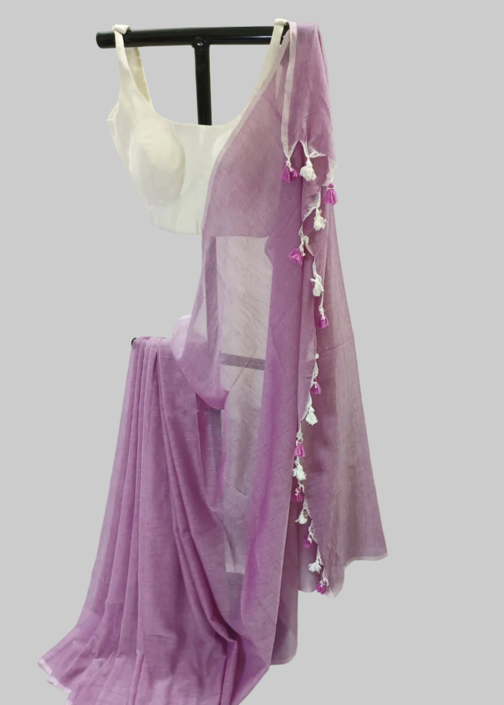 Purple saree with tassels on a white background