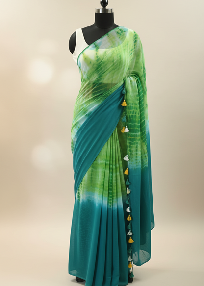 Green and blue mul cotton saree on a mannequin against a beige background