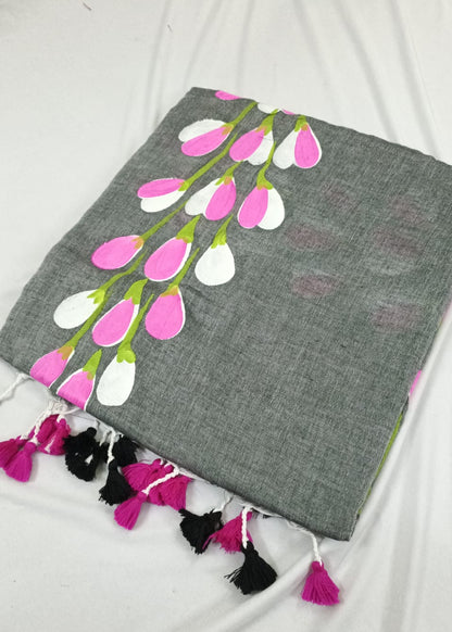 Gray saree with floral design and tassels on a white background